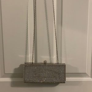Silver bedazzled clutch bag